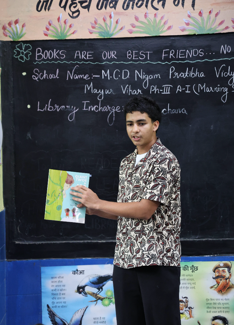 Inkspire founder holding a children's storybook
