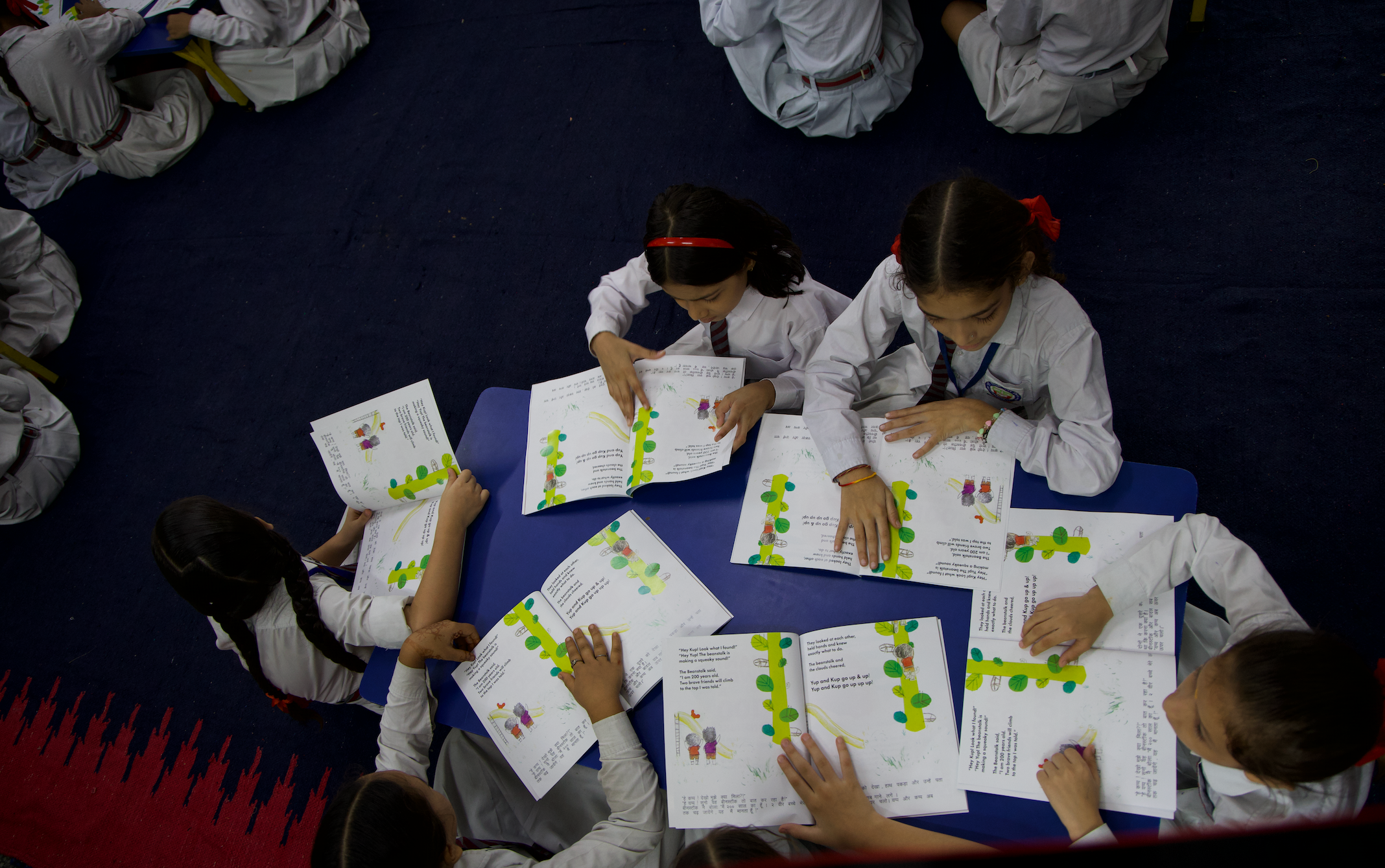Children reading the illustrated storybooks they created at an Inkspire workshop